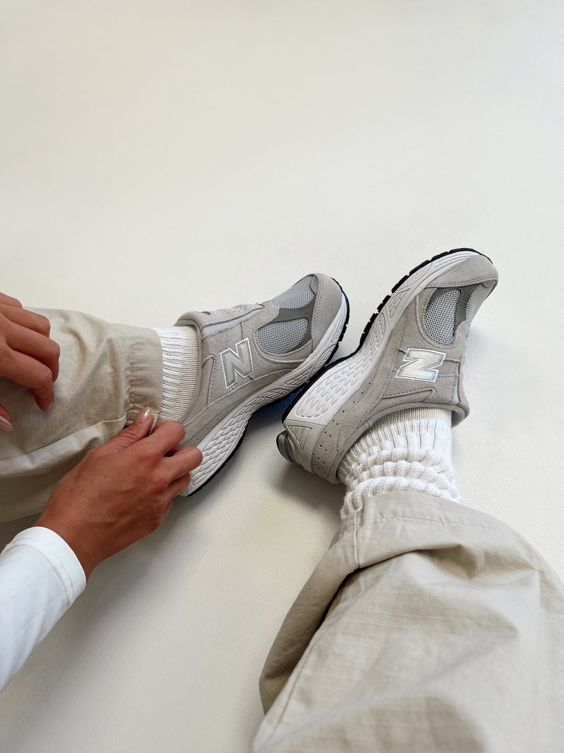 Faux suede sneakers, slip-on style Padded footbed, mesh netting detail, treaded sole