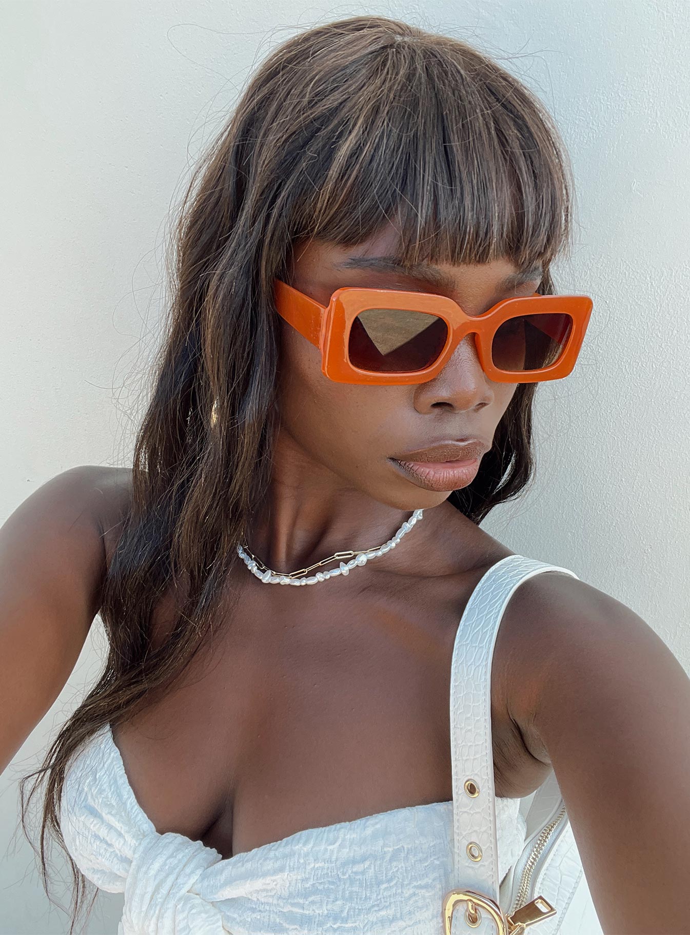 Sunglasses Vintage style frame Orange tinted lenses Wide arm Moulded nose bridge Lightweight