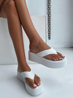 Sandals Faux leather material  Flip-flop style upper  Platform base  Square toe 