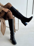Knee high boots Faux leather material Zip fastening at side Rounded toe Padded footbed Block heel