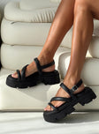 Faux leather sandals Rounded toe, chunky treaded sole, buckle fastening at ankle
