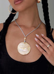 Necklace Gold-toned and pearl detail, shell pendant, soft rope necklace style Adjustable tie fastening