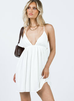 Mini dress Crinkle material Adjustable shoulder straps with tie fastening Plunging neckline Elasticated band at waist Low back