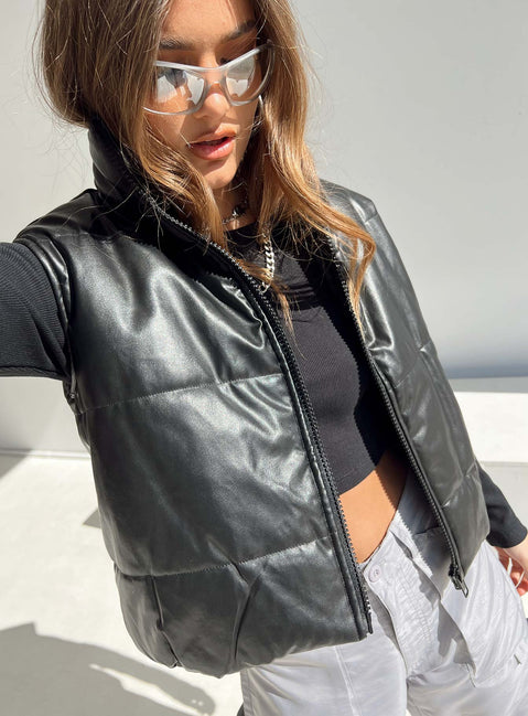 Puffer vest Main: 65% PU 35% polyester Lining: 100% polyester Faux leather material High neck Zip front fastening Elasticated waist Non stretch Fully lined