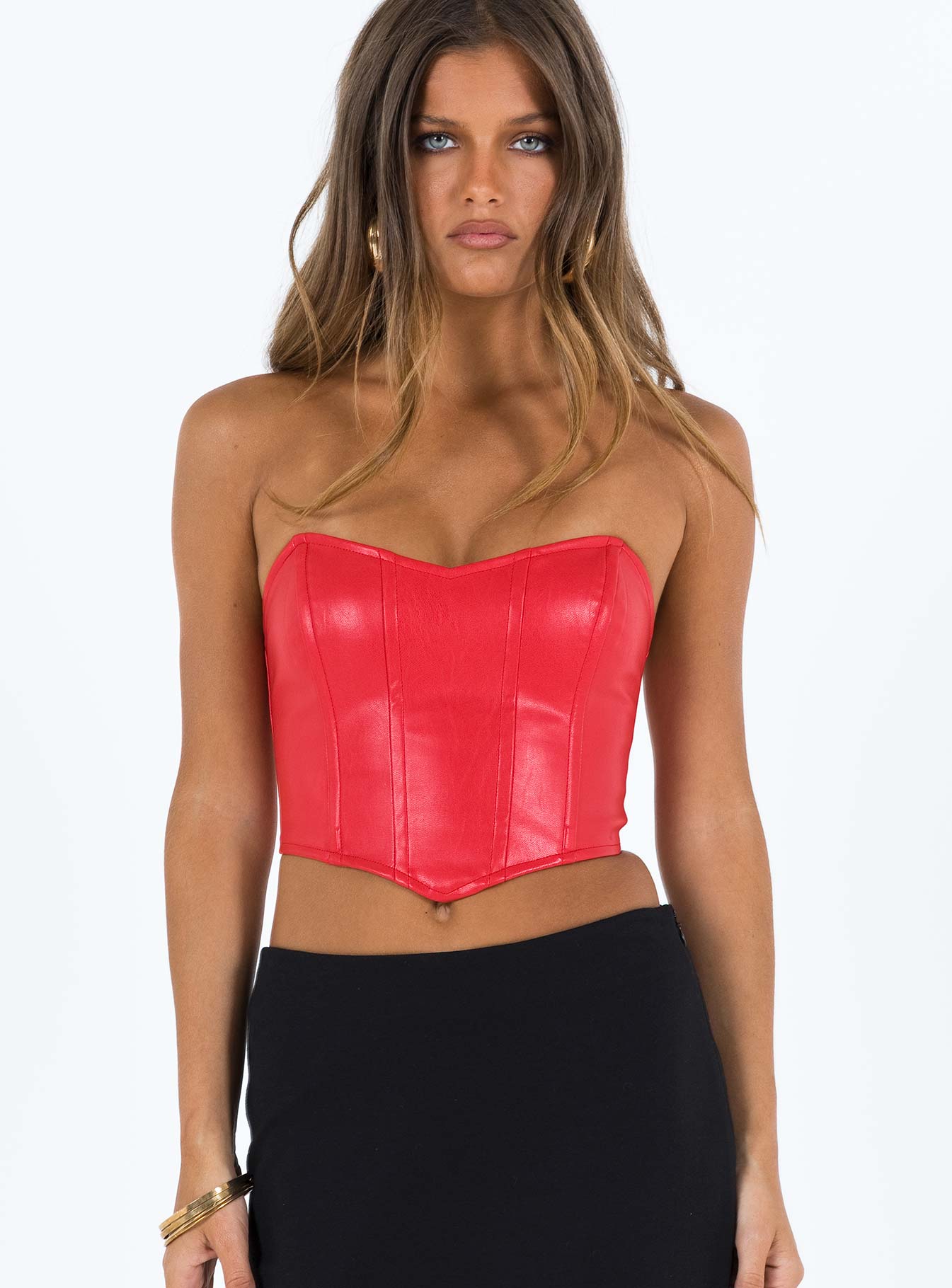 Red bustier Faux leather material Strapless design  Boning through front  Pointed hem  Zip fastening at back  Fully lined 