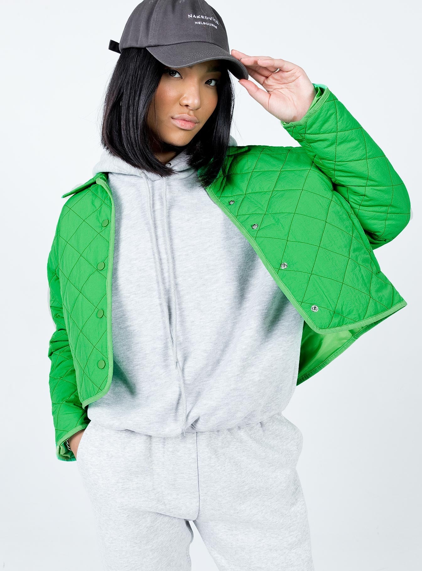 Cropped jacket  100% nylon  Quilted material Classic collar Press button front fastening  Twin hip pockets  Fully lined 