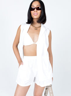 Matching three-piece set Bra top  Halter neck tie fastening  Oversized vest top  Lapel collar  Button front fastening  Twin front pockets  High waisted shorts  Elasticated waistband  Twin hip pockets 