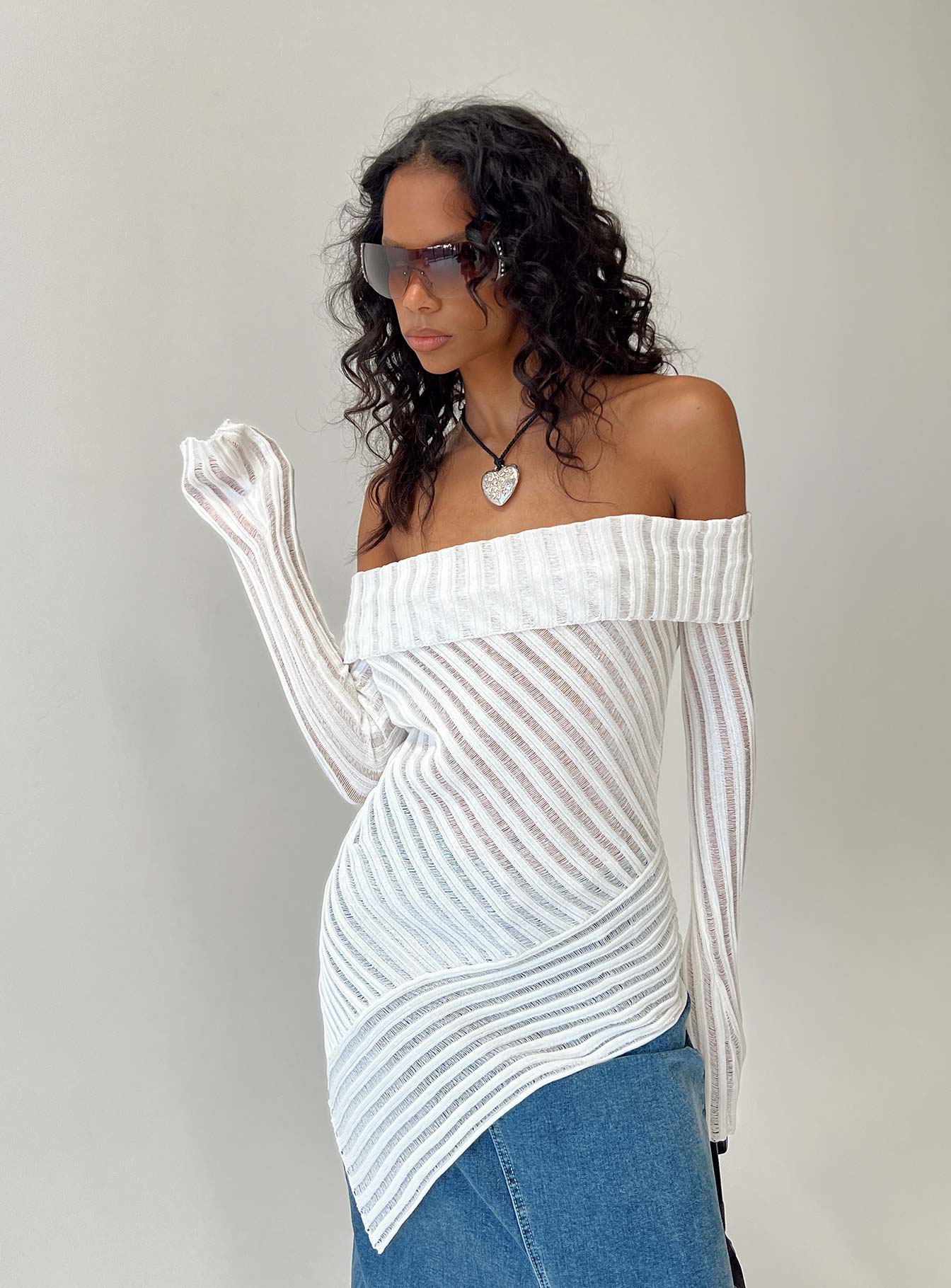 Sweater Sheer knit material Off-the-shoulder design Folded neckline Asymmetrical hemline Good stretch Unlined 