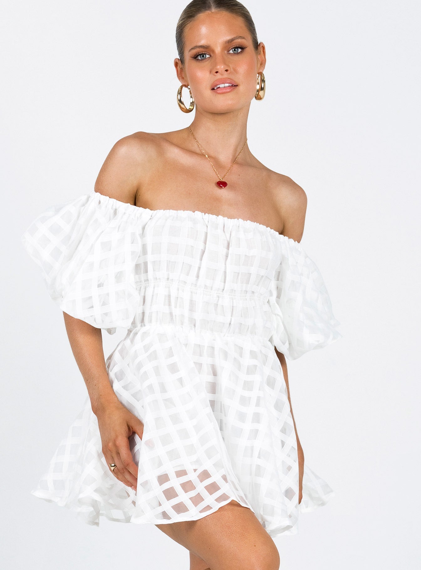 White mini dress Sheer material Off the shoulder design Puff sleeve Elasticated bands at waist