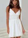 White mini dress Adjustable shoulder straps V neckline Fluffy trim Shirred waistband Ruched waist