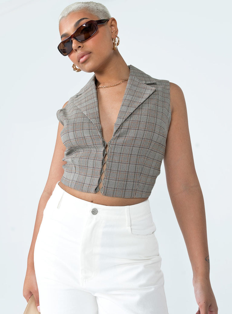 Vest top Plaid print  Lapel collar  Hook & eye front fastening Slights stretch  Fully lined 