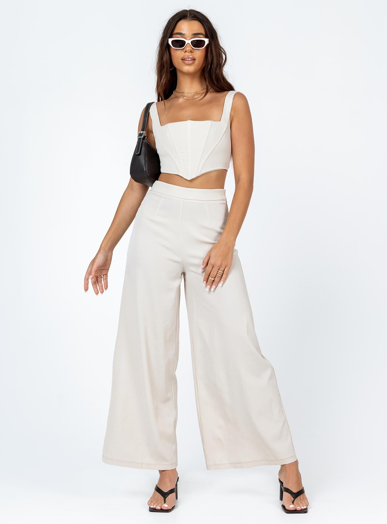 Matching set Silky material  Corset top  Boning through front  Zip fastening at back  High waisted pants  Invisible zip fastening at side  Wide leg 