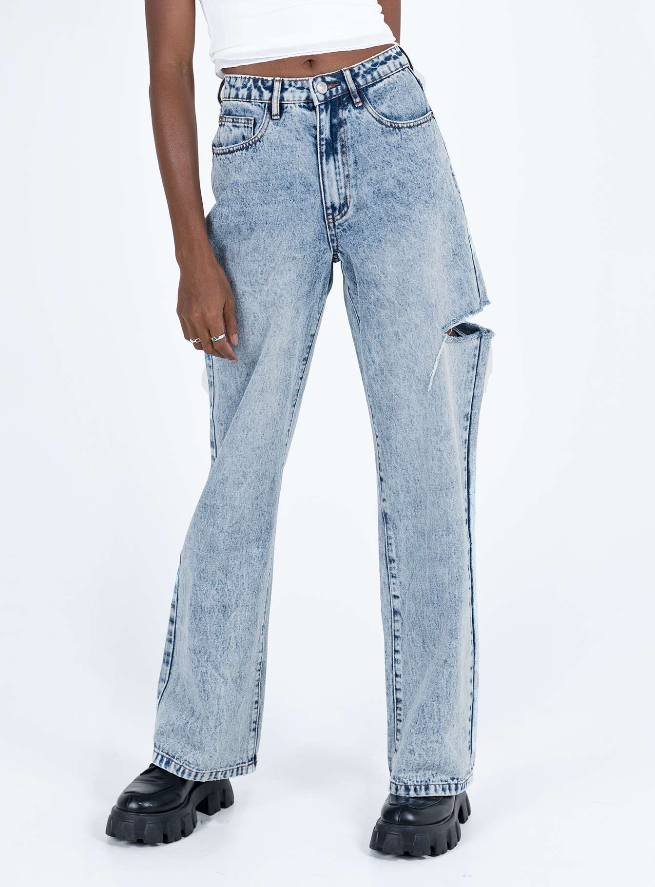 Jeans Mid wash denim High rise Belt looped waist Zip and button fastening  Classic five-pocket design Branded patch at back Rip at thigh Wide leg