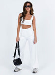 White matching set Crop top Fixed straps Invisible zip fasting at side High waisted pants Wide relaxed leg Belt loops at waist Zip and button fastening Stuble pleats at waist Twin hip pockets Non stretch  Lined top
