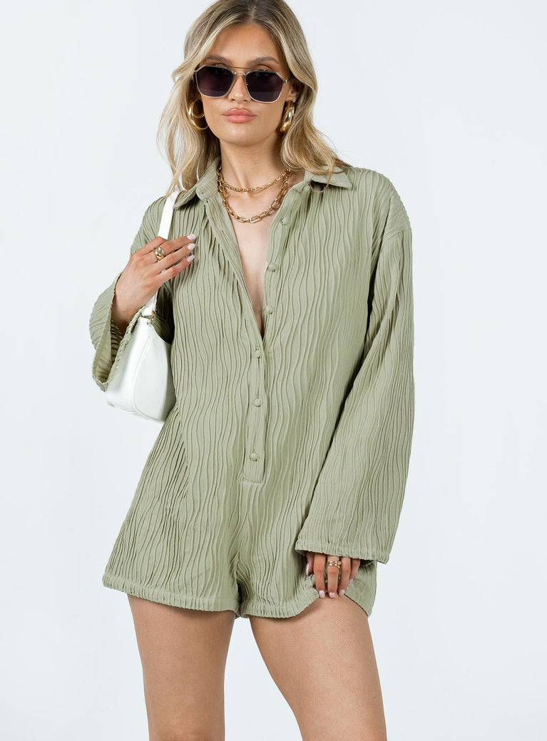Long sleeve romper Textured material  Classic collar Button fastening at front Good stretch