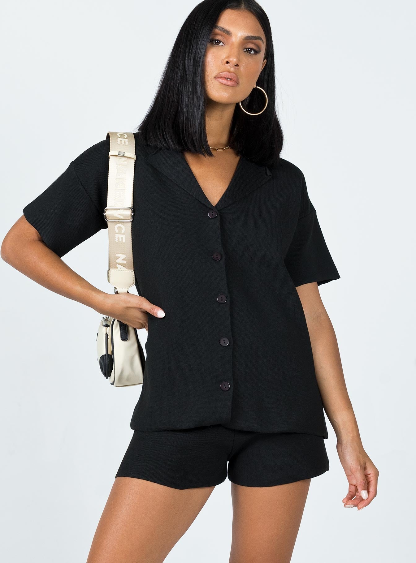 Matching set  Relaxed fit  Princess Polly Exclusive 63% recycled fibers 25% polyester 12% nylon  Soft knit material  V neckline  Button front fastening  High waisted shorts  Elasticated waistband 