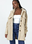 Teddy coat Faux fur material  Classic collar  Button front fastening  Twin chest pockets