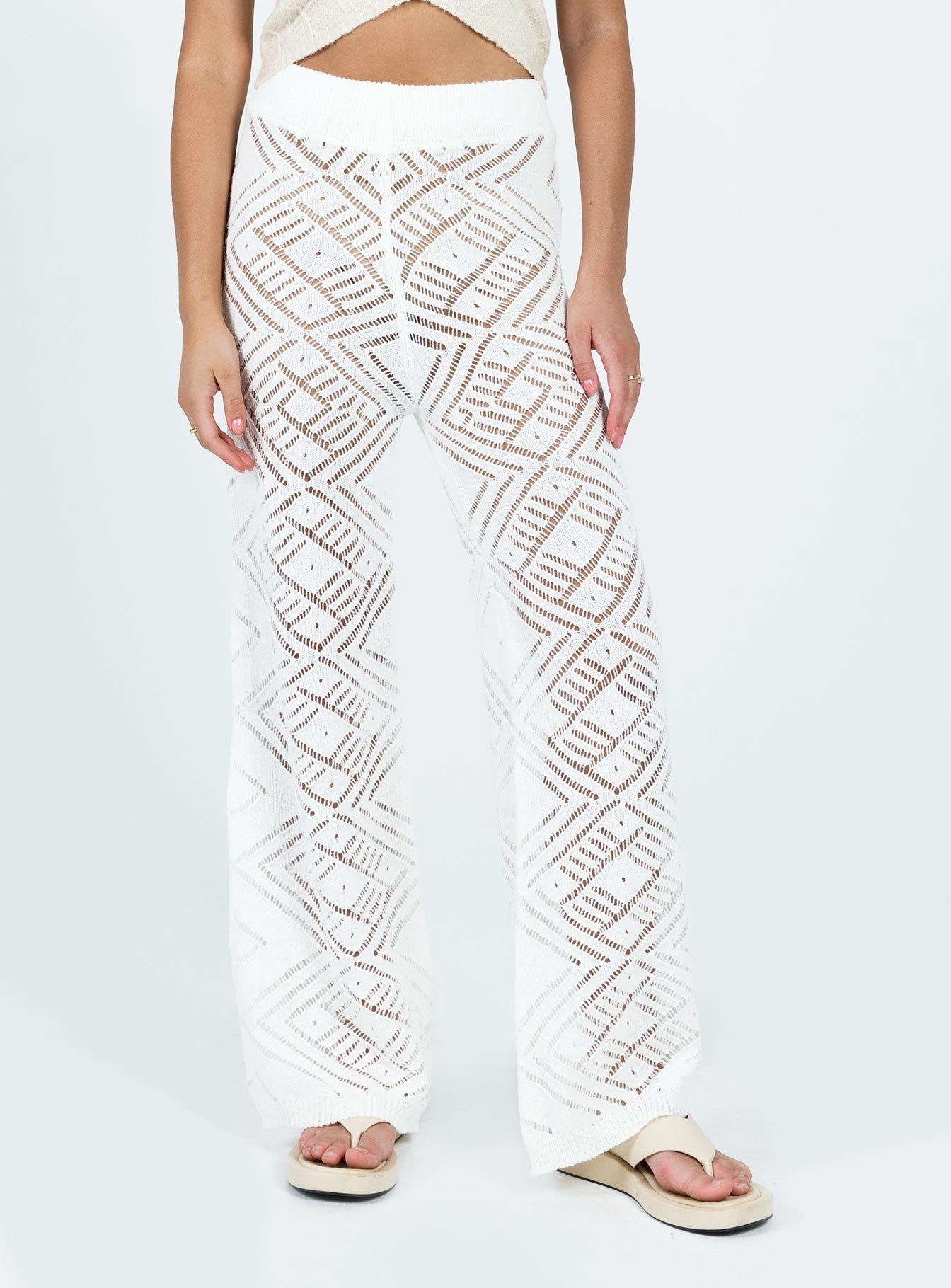 High waisted pants Sheer knit material Elasticated waistband  Good Stretch