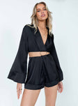 Black romper Silky material Classic collar  Plunging neckline  Semi-detached shorts  Gold-toned ring at waist  Flared long sleeves  Elasticated waistband  Fixed rolled hem  Separate invisible zips at back of top & shorts 