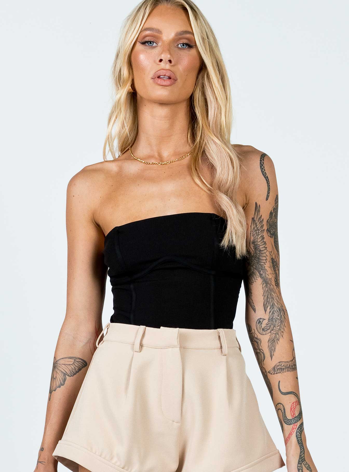 Bodysuit  Slim fitting  95% polyester 5% elastane  Ribbed material  Strapless design  Invisible zip fastening at side  High cut leg  Cheeky style bottom  Press clip fastening at base 