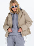 Beige puffer jacket Hood with drawstring Zip front fastening Twin front pockets Elasticated cuffs Drawstring waist