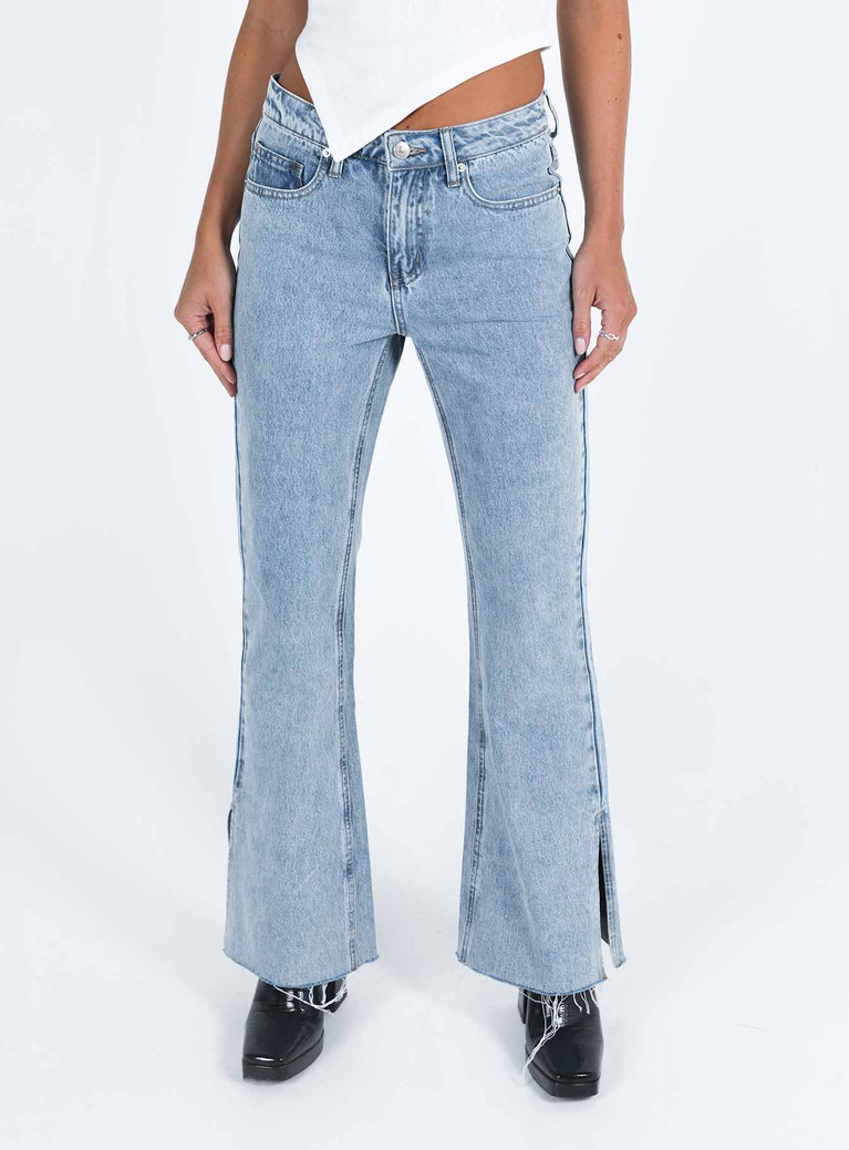 Jeans Mid wash denim Low rise Belt looped waist Classic five pocket design Branded patch at back Slim leg Split at hem Raw edge hem