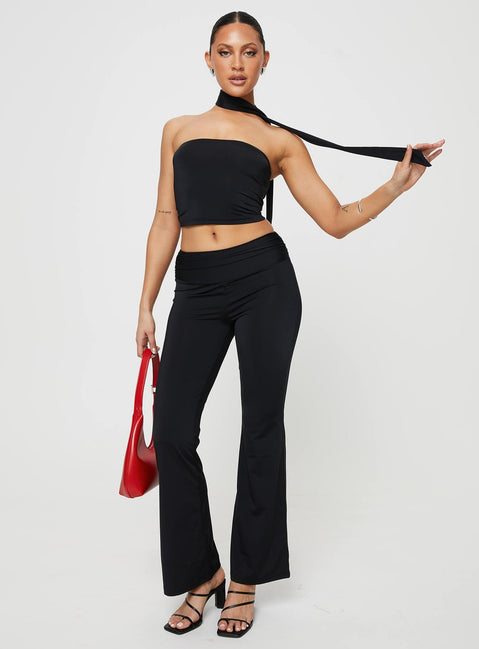 Matching set Crop top, elasticated band at bust, attached neck tie Low rise pants, thick elasticated waistband, ruching details at side Good stretch, partially lined
