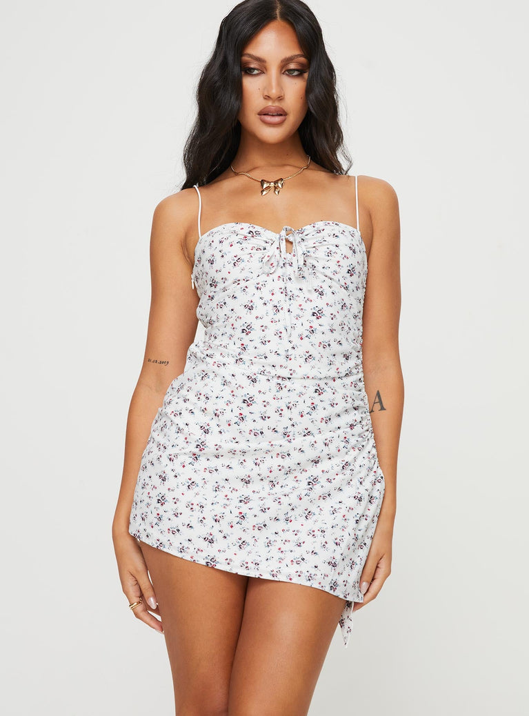 Floral mini dress Elasticated shoulder straps, sweetheart neckline, tie fastening at bust, invisible zip fastening at side, adjustable ruching at side