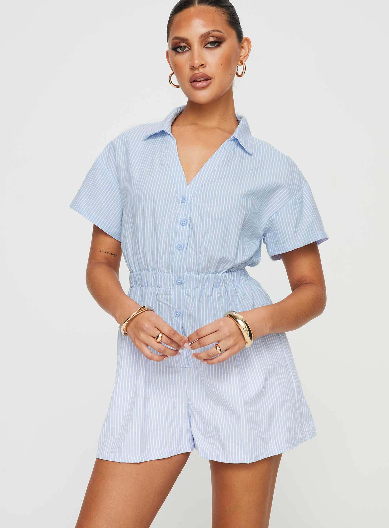 Striped romper Classic collar, button fastening down front, elasticated waistband