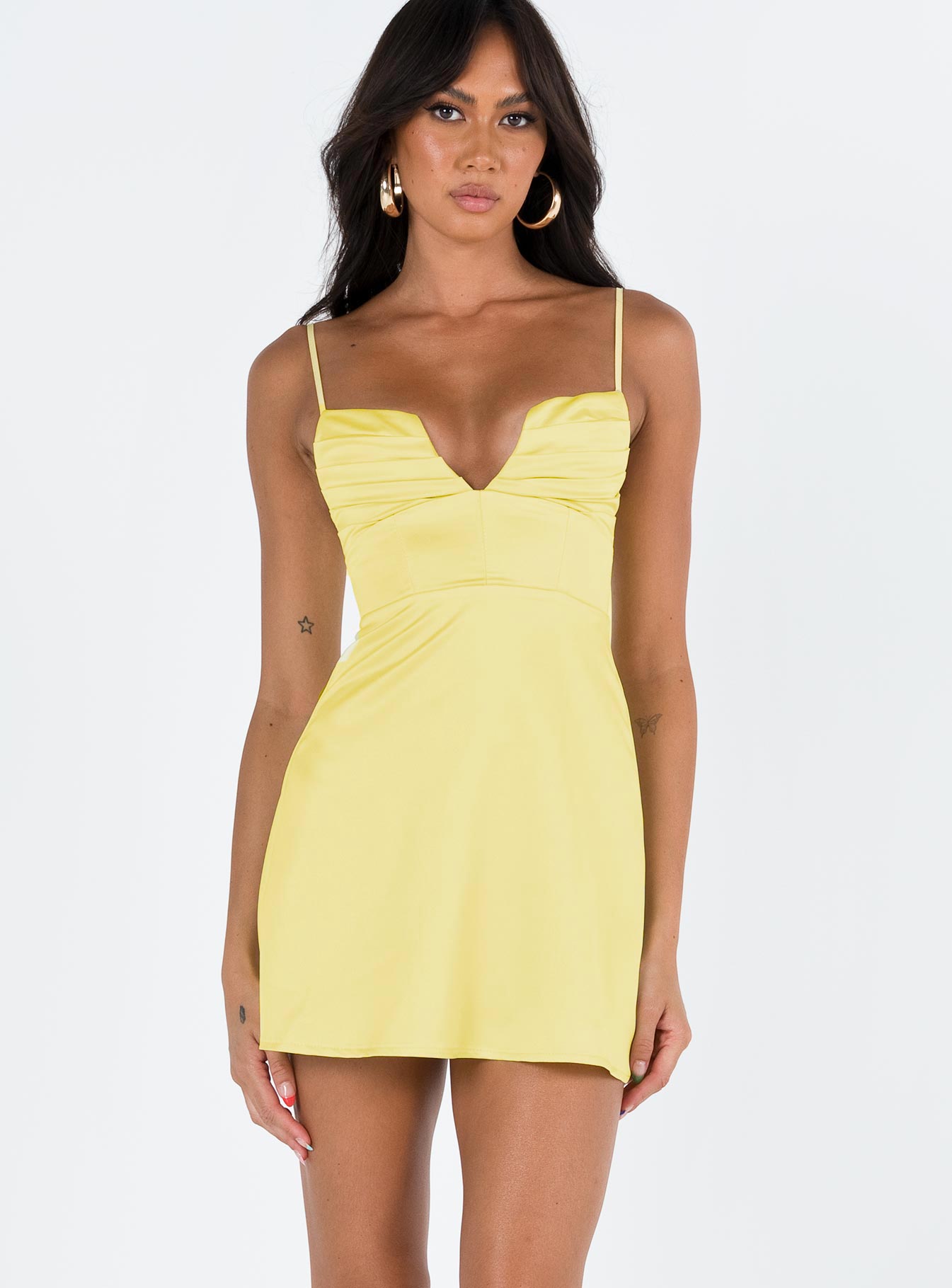Yellow mini dress Silky material Pleated bust detailing with V neckline Boning through bodice Adjustable straps Invisible zip fastening at back