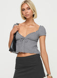 Blue v-neck top Cap sleeve, textured material, ruffle detail, tie detail at bust, elasticated back