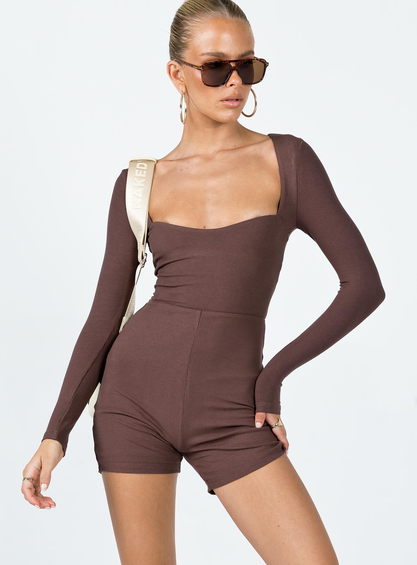 Romper Ribbed material  Square neckline  Cut out back  Tie fastening at back 