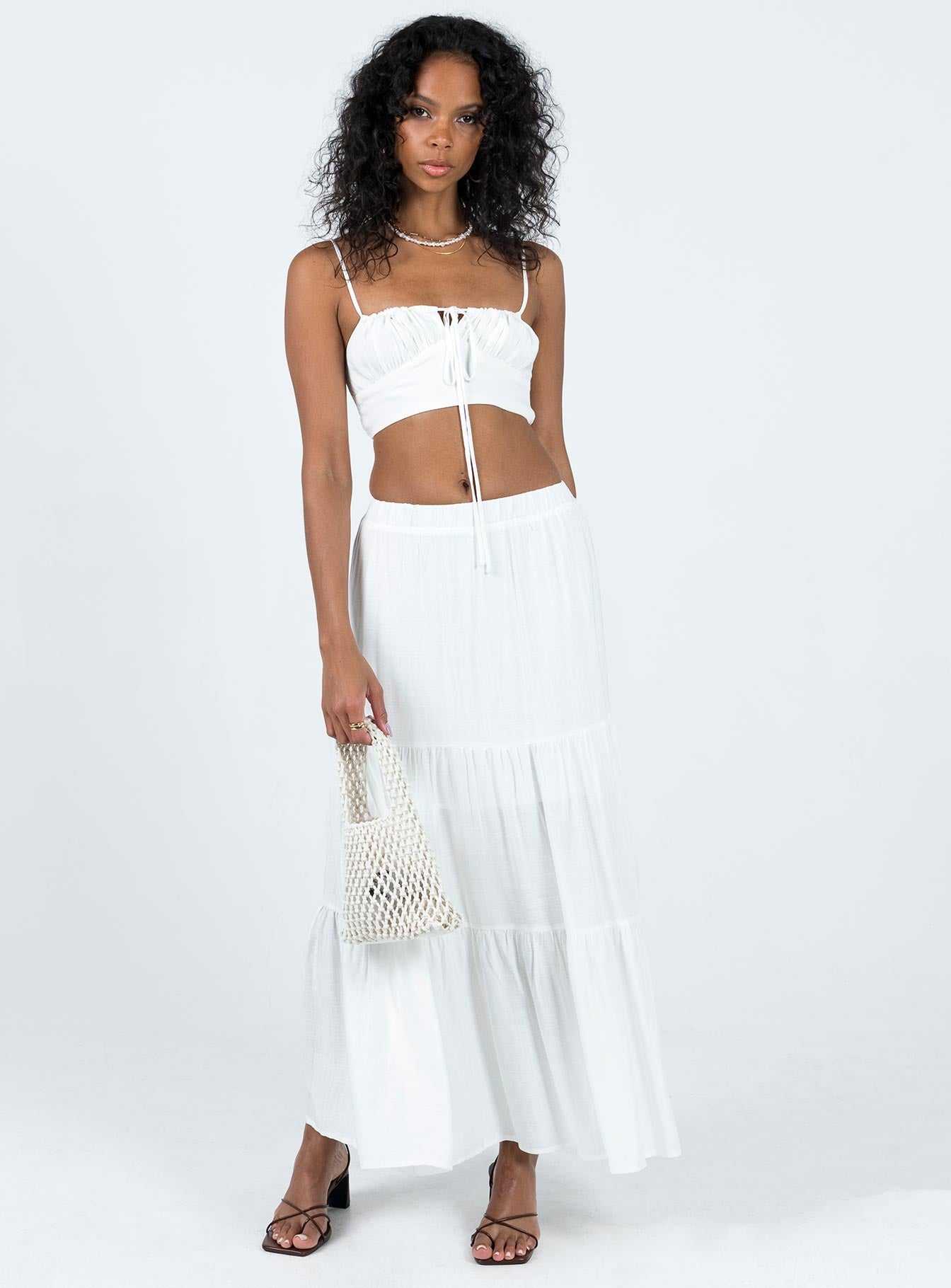 Two piece set Crop top Adjustable shoulder straps Adjustable tie fastening at front Shirred back Maxi skirt Elasticated waistband Tiered skirt
