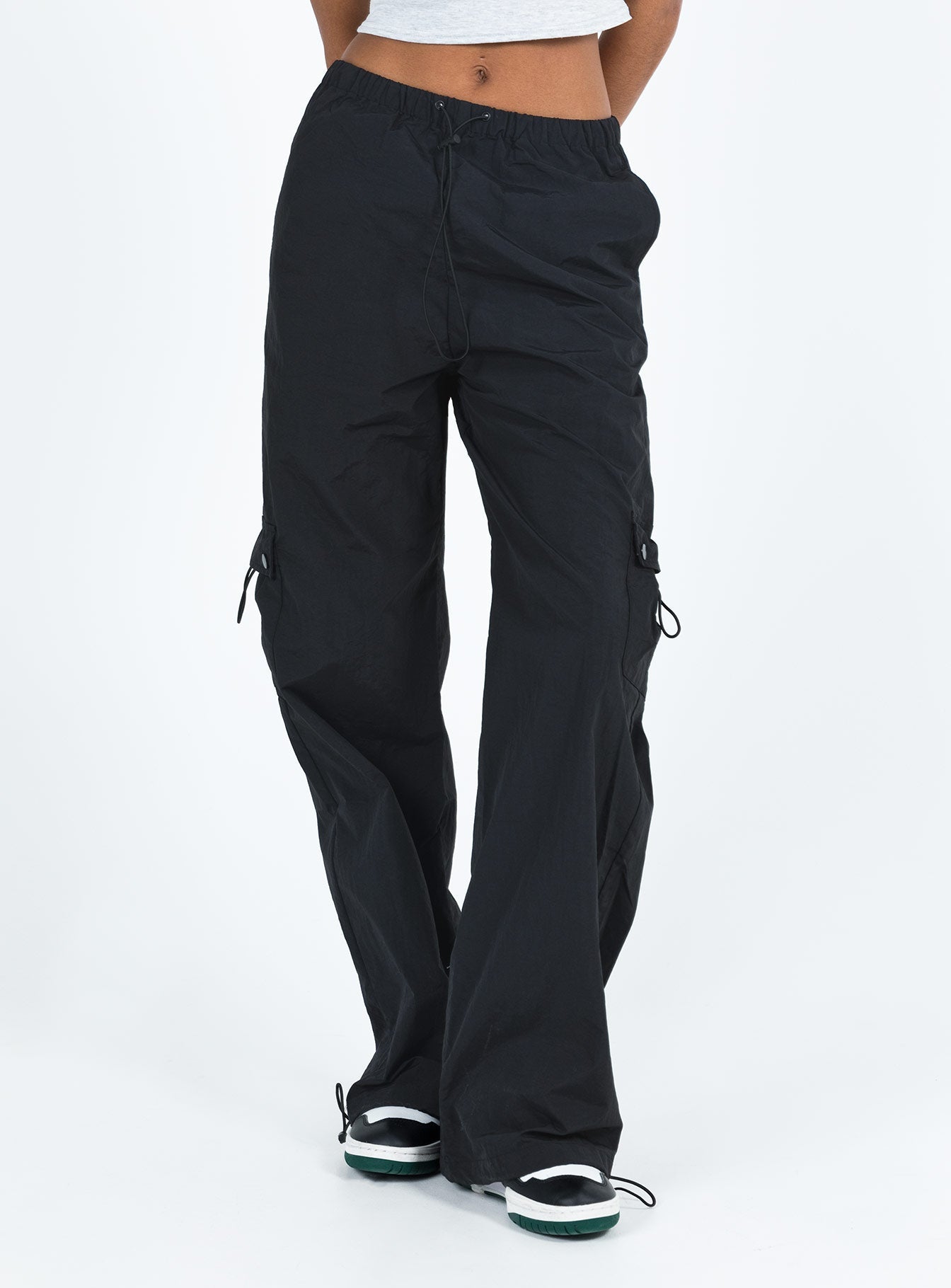 Pants Mid rise Elasticated waistband with drawstring Four pocket design Wide leg Drawstring cuff