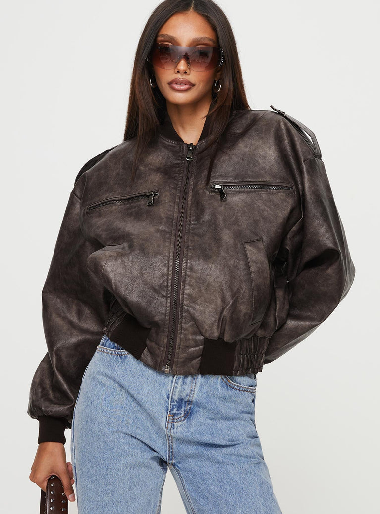 Chocolate brown Biker jacket Faux leather material four pocket design shoulder buttoning detail long sleeves elasticated cuffs and waist zip fastening at front