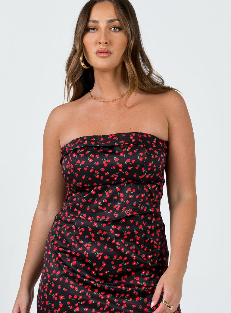 Strapless top Lining: 100% polyester Floral print Inner silicone strip at bust Folded neckline Zip fastening at back