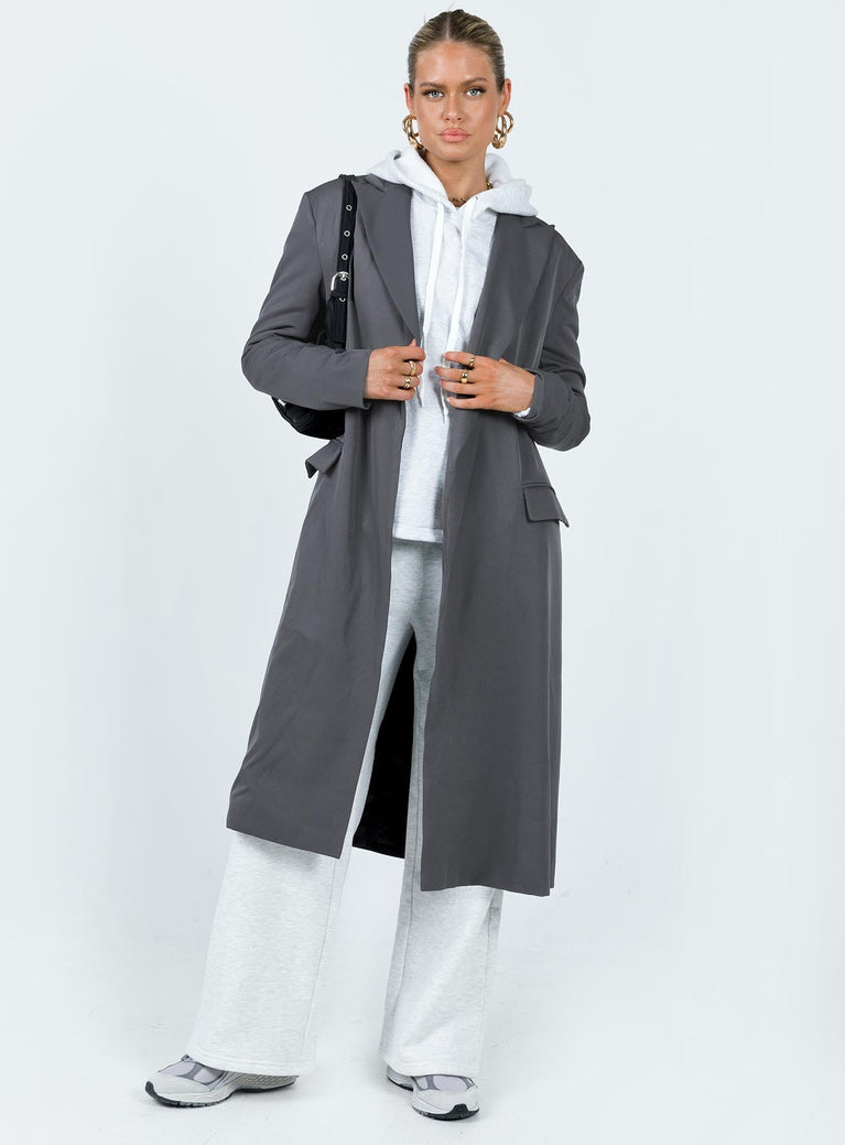 Trench coat Lapel collar Twin hip pockets Split at back