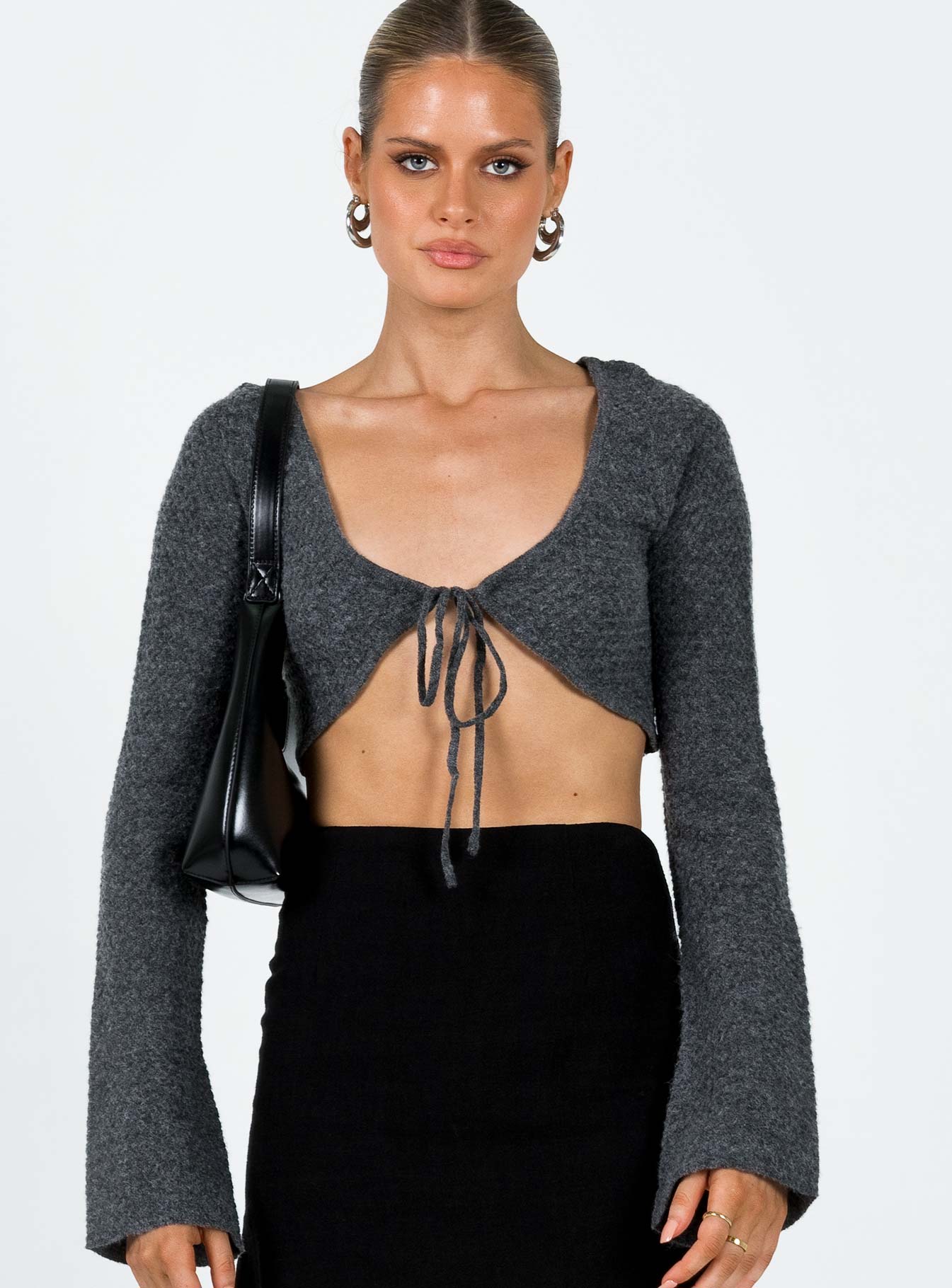 Bolero Knit material V neckline Tie fastening at bust Flared sleeve  Good stretch Unlined 