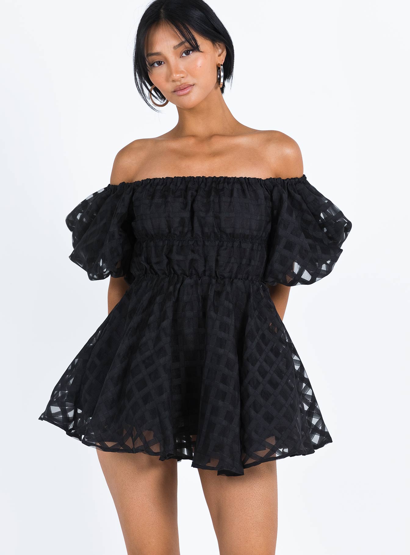 Black mini dress Sheer material Off the shoulder design Puff sleeve Elasticated bands at waist