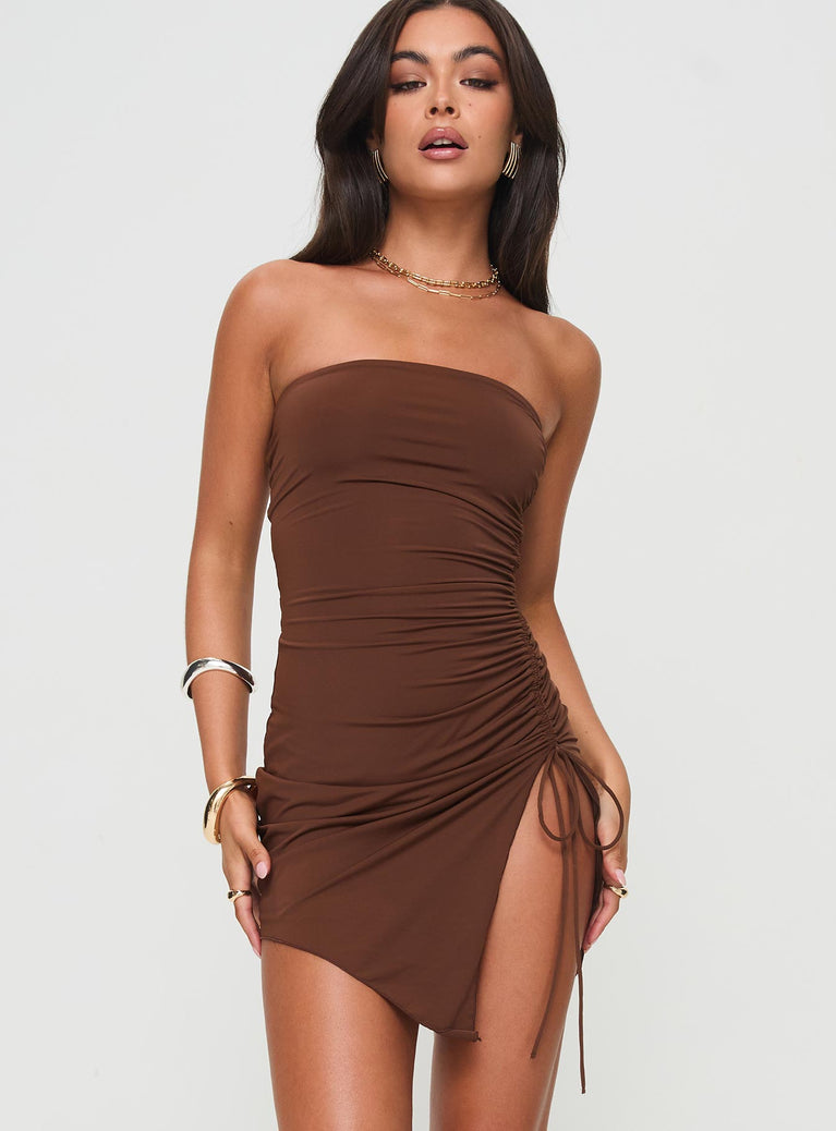 Strapless mini dress Adjustable ruching at the side with tie fastening,asymmetrical hem, inner silicone strip at bust  Good stretch, fully lined  Princess Polly Lower Impact