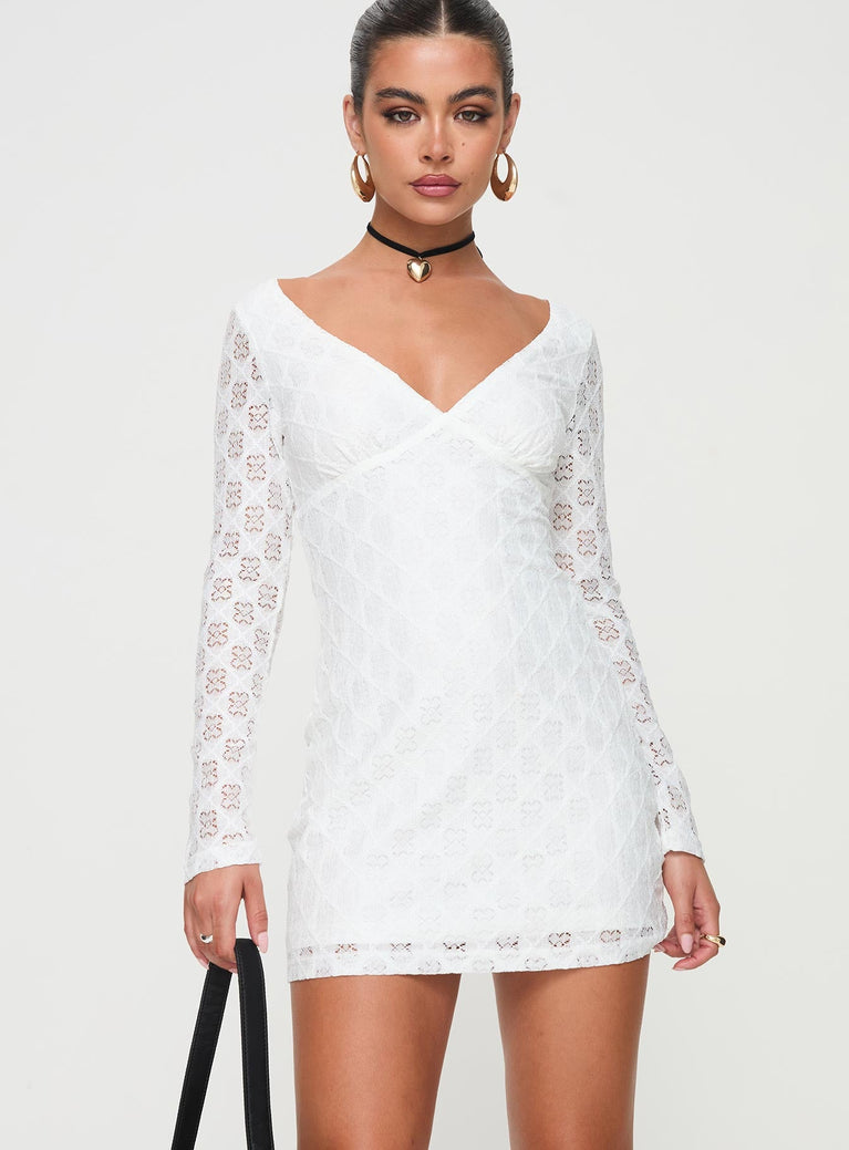 Long sleeve dress Lace overlay, v-neckline, tie fastenings at back, partially exposed back, invisible zip fastening at the side, slightly sheer Good stretch, lined body, sheer sleeves