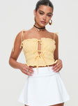 Crop top Adjustable shoulder straps, ruched design, tie fastenings down front Non-stretch material, lined bust