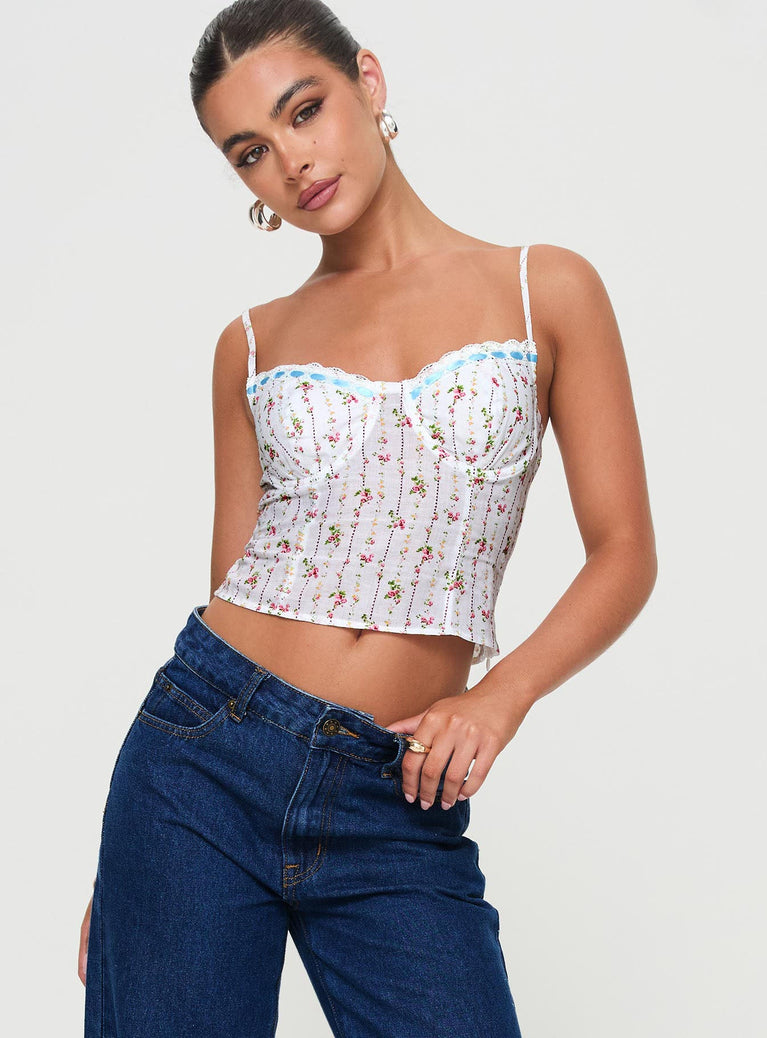 Top Floral print, adjustable straps, underwire with soft cups at bust, lace trim detail, invisible zip fastening Non-stretch material, lined bust