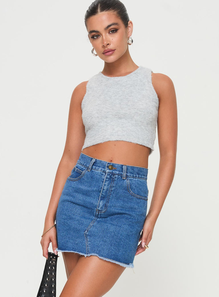 Denim mini skirt Belt looped waist, zip & button fastening, classic five pocket design , branded patch at back, raw edge hem Non-stretch material, unlined 