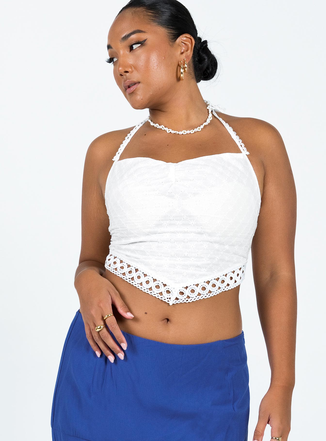 White top Cotton Halter neck tie fastening Elasticated bands at back Pointed hemline