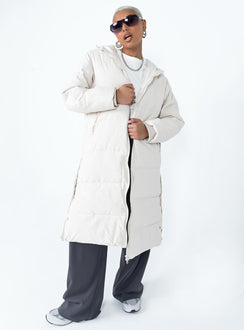 Longline puffer jacket Drawstring hood  Zip front fastening  Twin hip pockets  Press button fastening down sides  Fully lined 