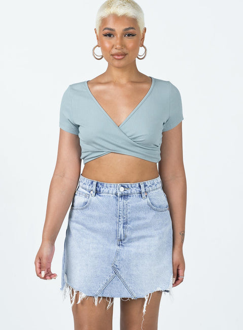 Mini skirt Mid-wash denim A-line design High waisted  Classic five pocket design Zip & button fastening Belt looped waist Raw edge hem Distressed detail