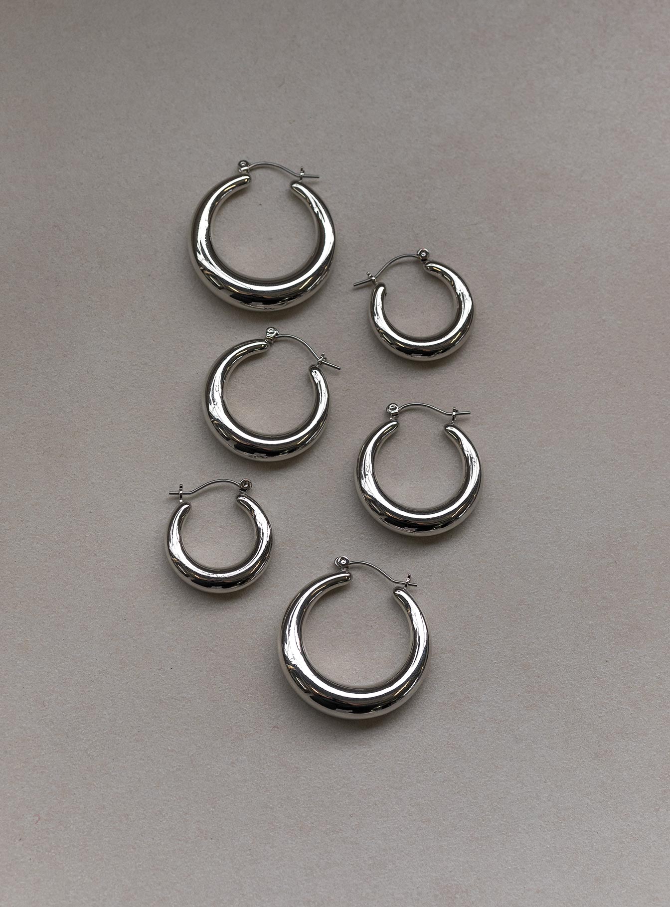 Earring pack Pack of three  Latch fastening  Silver-toned  Hoop style 