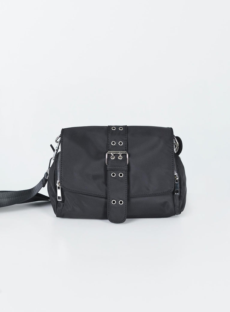 Crossbody bag  Princess Polly Exclusive Nylon material  Silver-toned hardware  Removable shoulder straps Removable & adjustable crossbody strap  Faux buckle front  Magnetic button fastening  Zip fastenings Two external pockets  Two internal pockets  Flat base