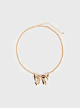Gold-toned necklace Bow charm, lobster clasp fastening